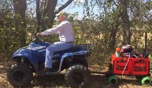 ATV towing a garden cart.