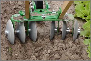 disc harrow loosening garden soil 